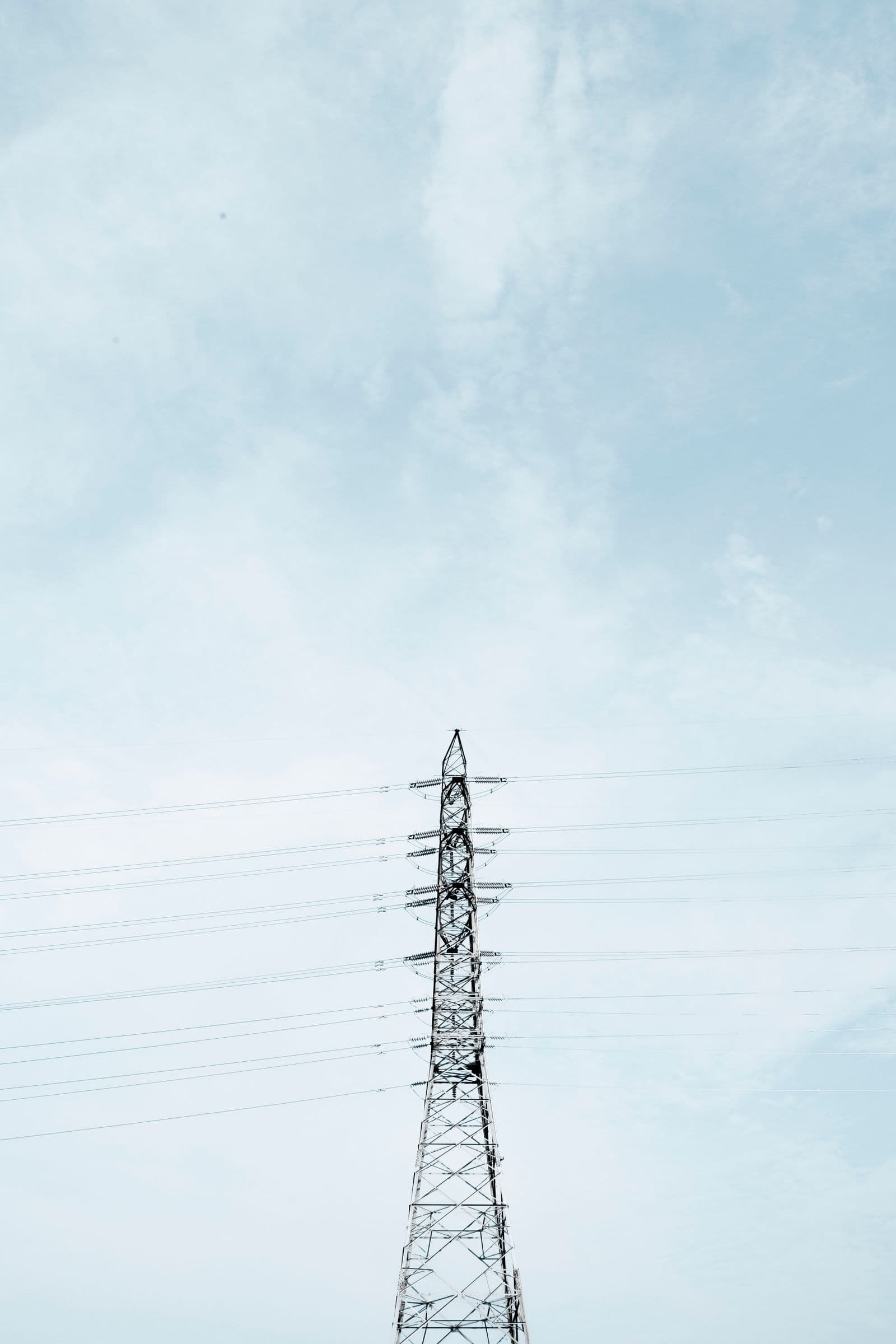 High-voltage transmission towers carrying lines toward the horizon.